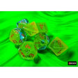 Set of transparent dice with colored numbers on a green background
